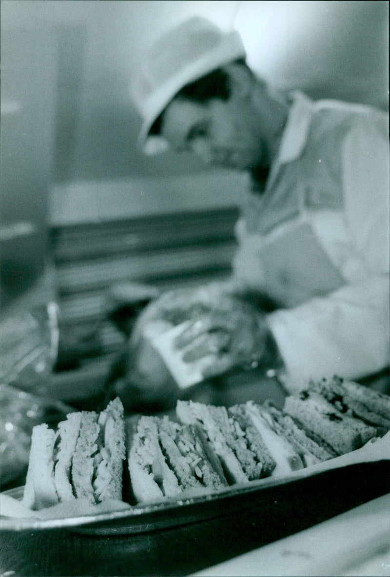 Members of the Pedlars Sandwich Co-op prepare sandwiches for customers. - Vintage Photograph