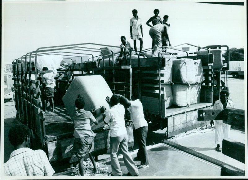 A group of refugees celebrate Purim near the Israeli-Jordanian border. - Vintage Photograph