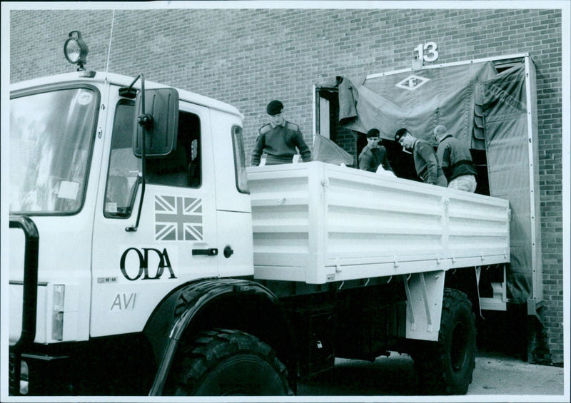 Volunteers loading supplies for Bosnia at Oxfam Warehouse in Bicester, England. - Vintage Photograph