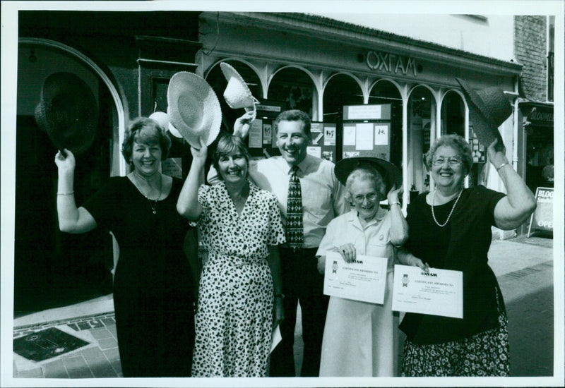 Five members of the Wallingford branch of Oxfam receive certificates in recognition of their service on September 1, 1998. - Vintage Photograph