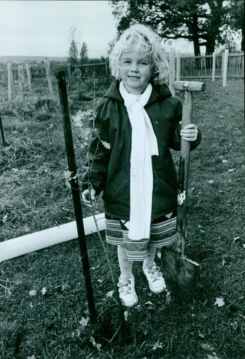 Tara Kozul plants an oak tree in South Park on Tree Day. - Vintage Photograph