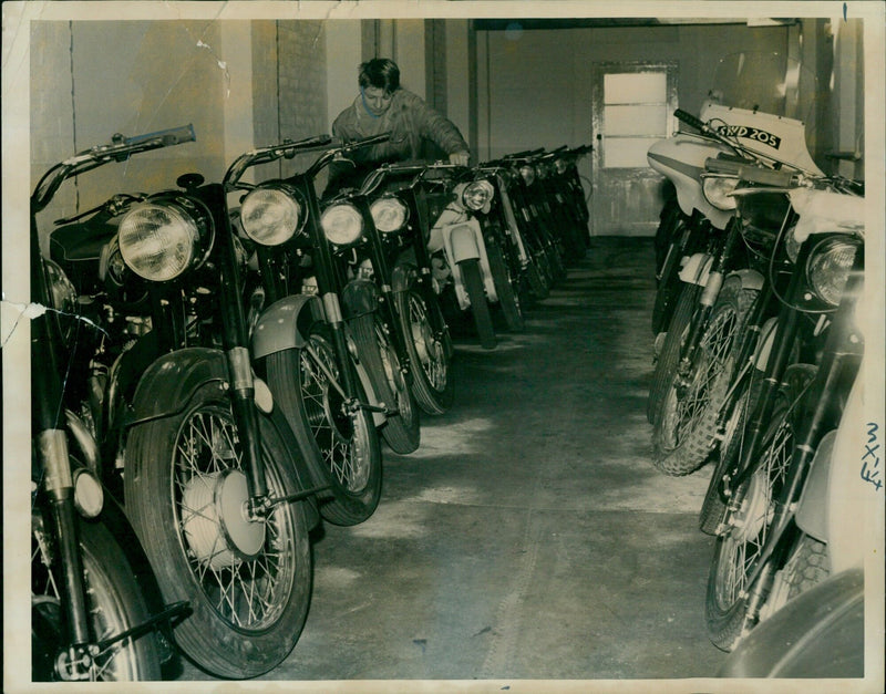 Motorcycles and cars drive down a quiet street on a Monday afternoon. - Vintage Photograph