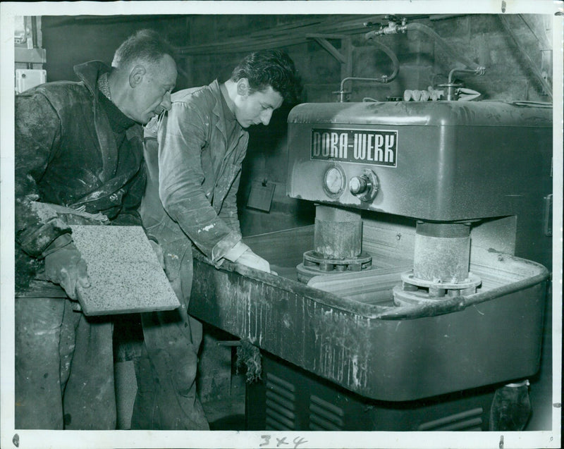 A tile-manufacturing machine operates at Minoli & Co. in Oxford. - Vintage Photograph