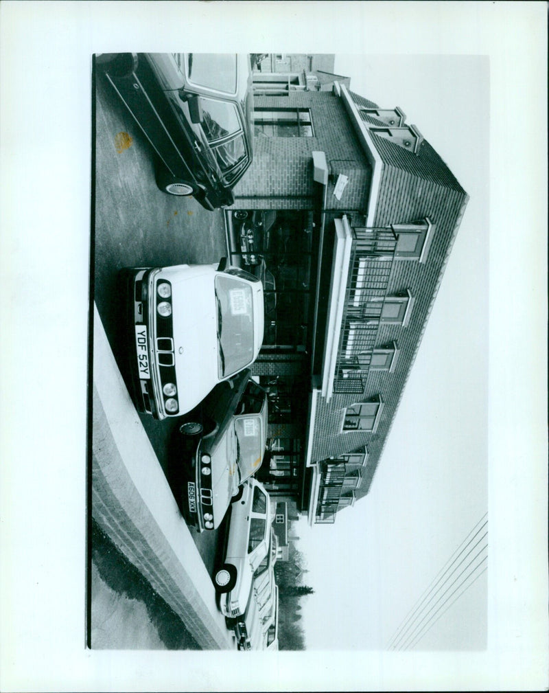 Workers at Cumner Hill Garage in Oxfordshire are seen fixing a car. - Vintage Photograph