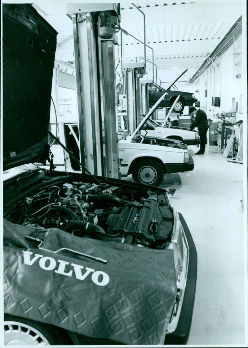 A Volvo Motorworld car advertisement at a Botley Road workshop area. - Vintage Photograph