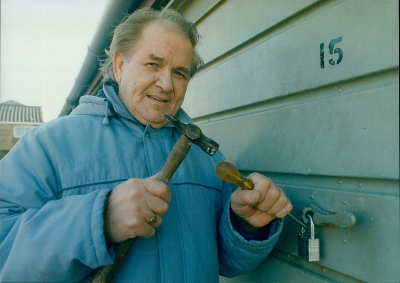 Mr. William Caldwell breaks into his own garage after the council locks him out. - Vintage Photograph