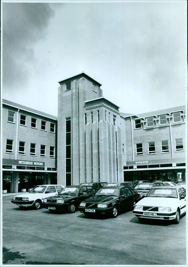 View of Motorworld featuring Mitsubishi Motors, Volvo, and other vehicles. - Vintage Photograph