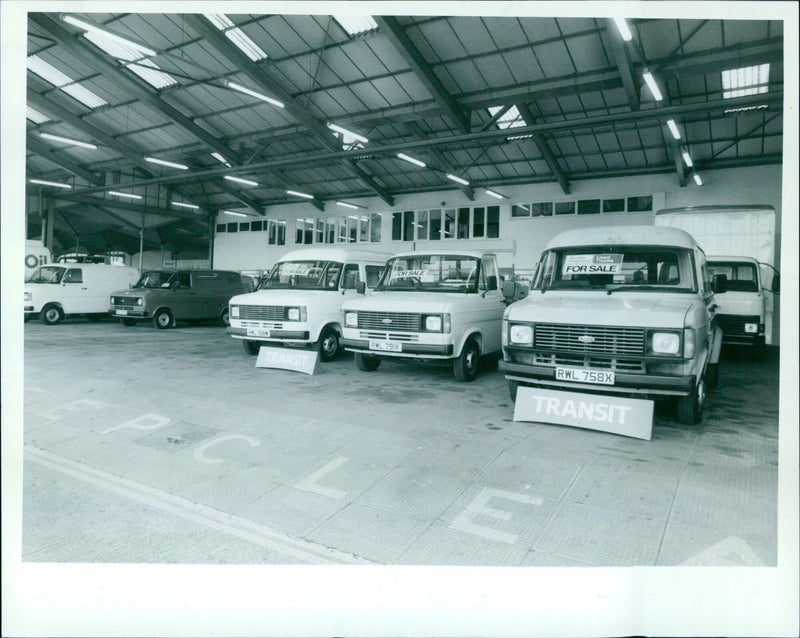 A variety of commercial vehicles for sale. - Vintage Photograph