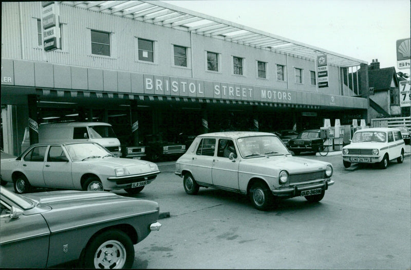 A selection of classic cars parked at Bristol Street Motors. - Vintage Photograph