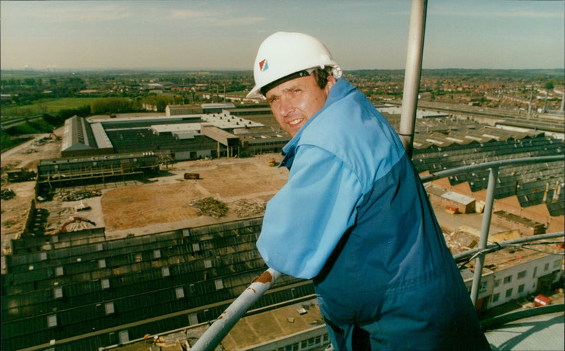 Alan Keey, project manager, overlooks a demolition site. - Vintage Photograph