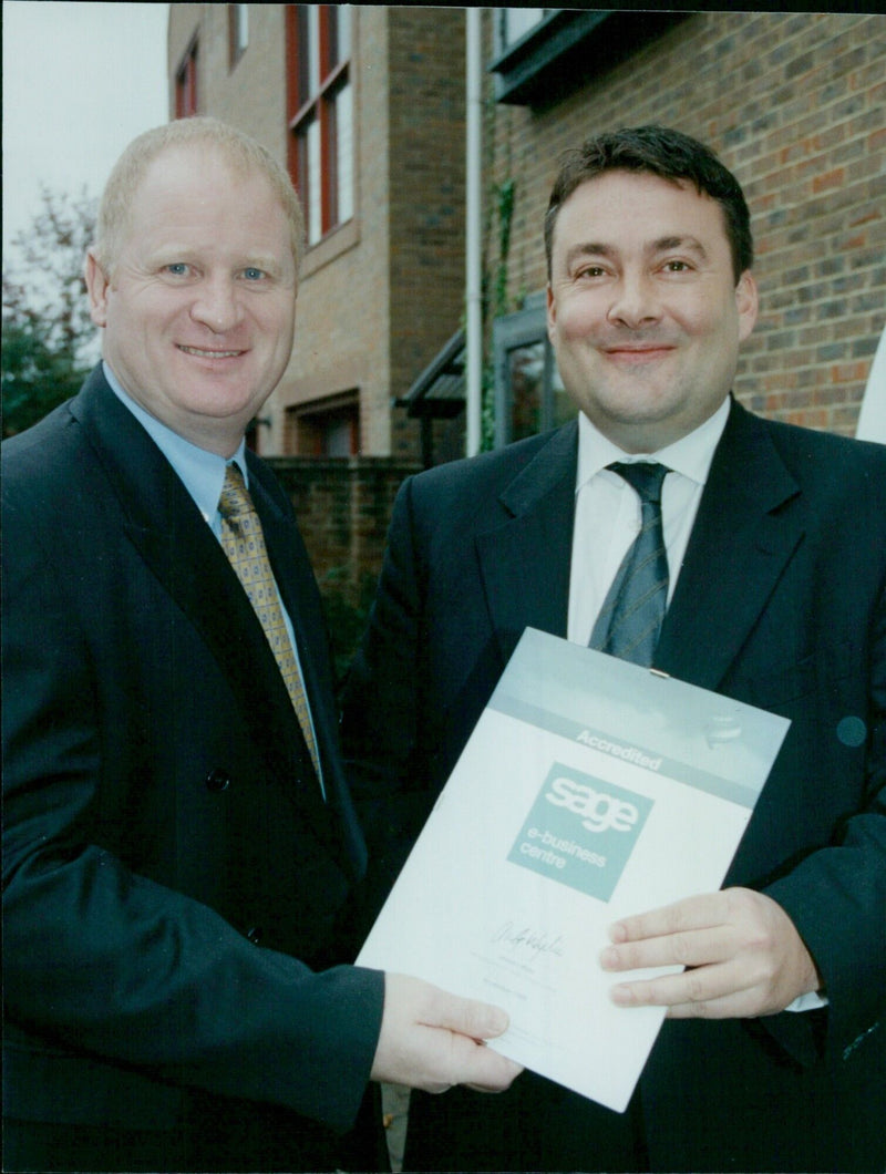 Richard Clayton, Director of the Oxford Miell Company, receives a Sage Training accreditation award. - Vintage Photograph