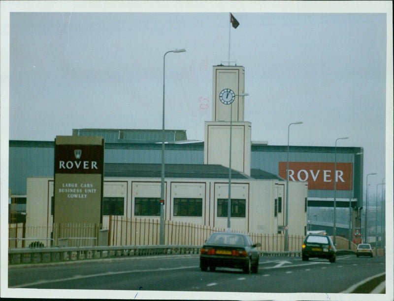 Employees work on the assembly line at the Rover Car Plant in Cowley, Oxford, England. - Vintage Photograph