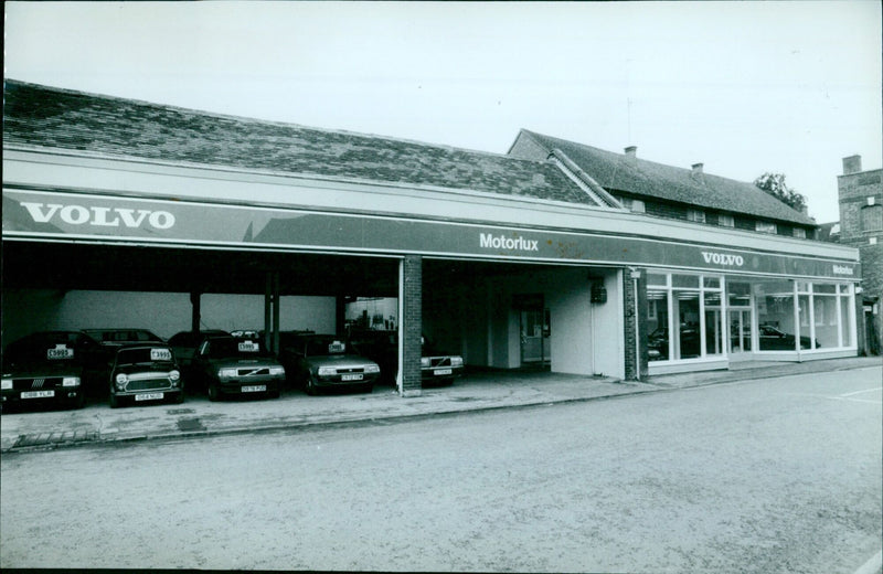 A selection of cars available for sale at Motorlux. - Vintage Photograph