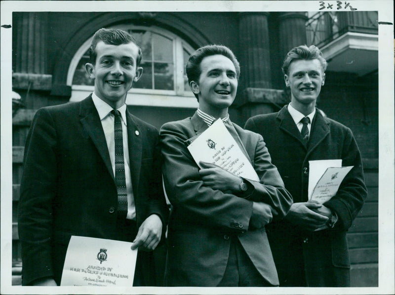 Three apprentices from the Pressed Steel Company receive gold awards from the Duke of Edinburgh at Buckingham Palace. - Vintage Photograph