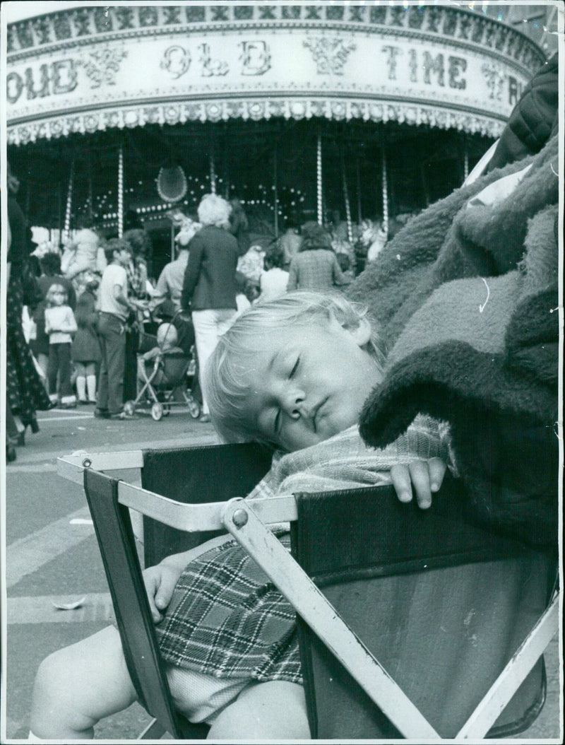 Victoria Brown, 20 months, takes a nap at St. Giles Fair in Old Marston, Oxfordshire. - Vintage Photograph