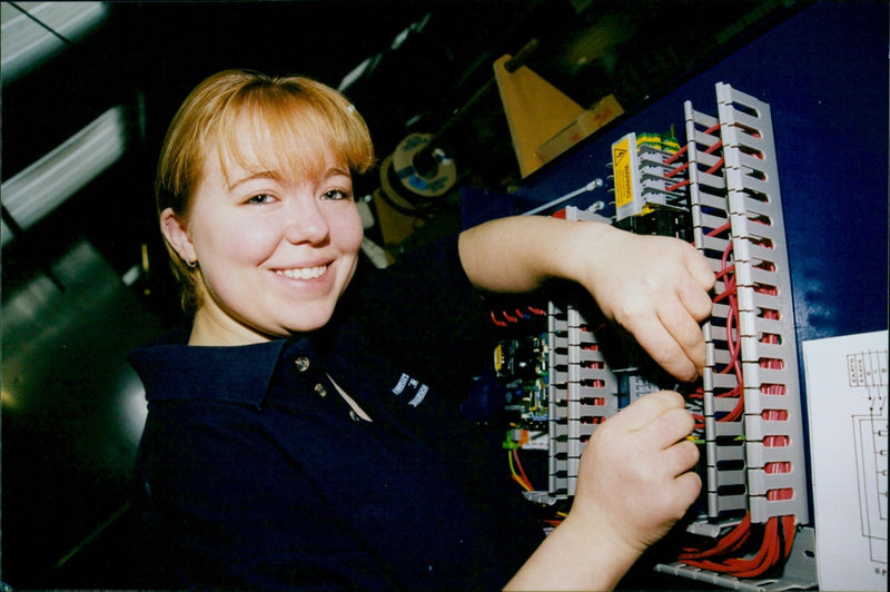 Maria Bowlte, the trainee of the Earth Earth B 1 Warning firm, works on a design. - Vintage Photograph