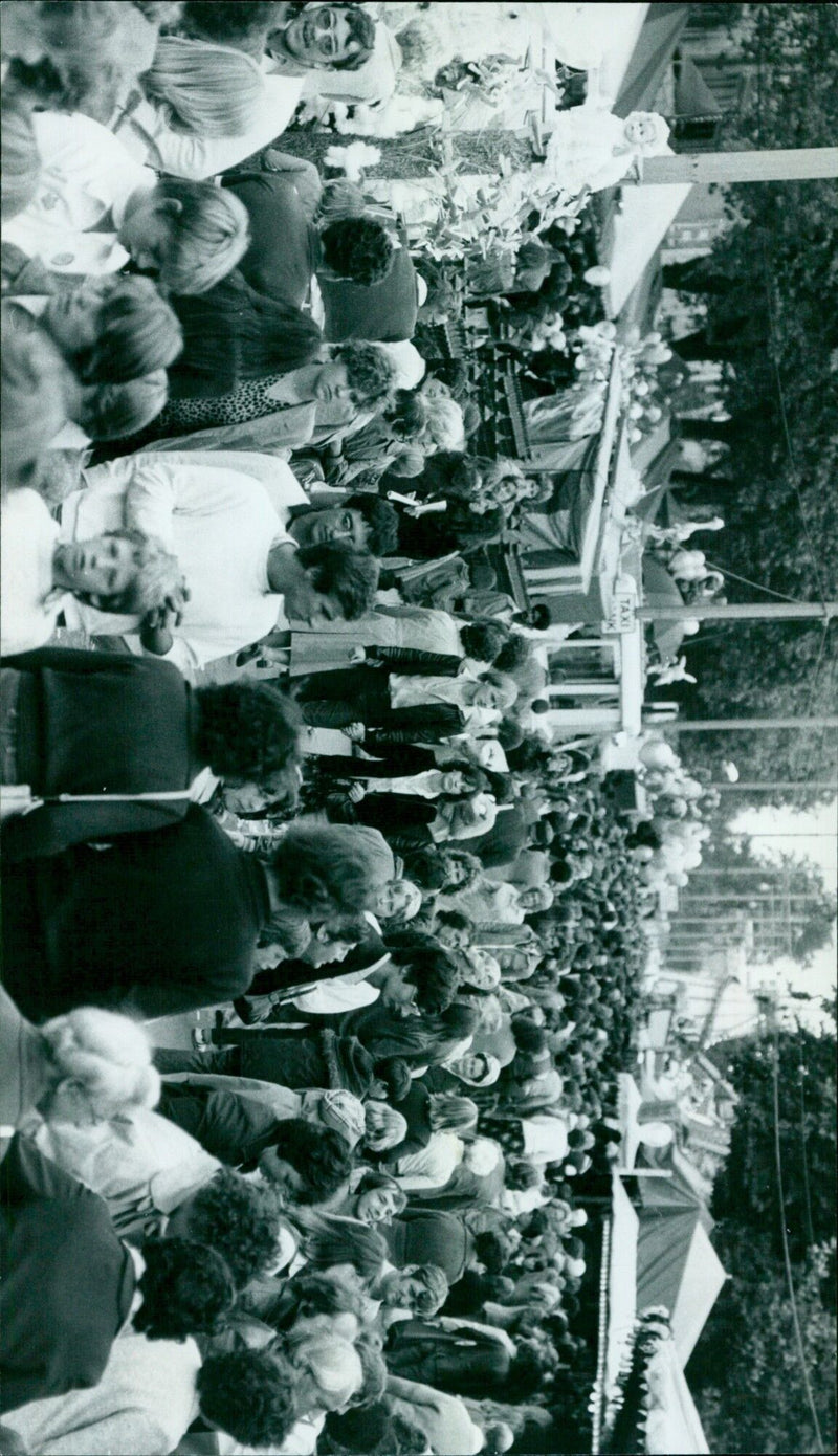 A large crowd of people marching in unison in a demonstration. - Vintage Photograph