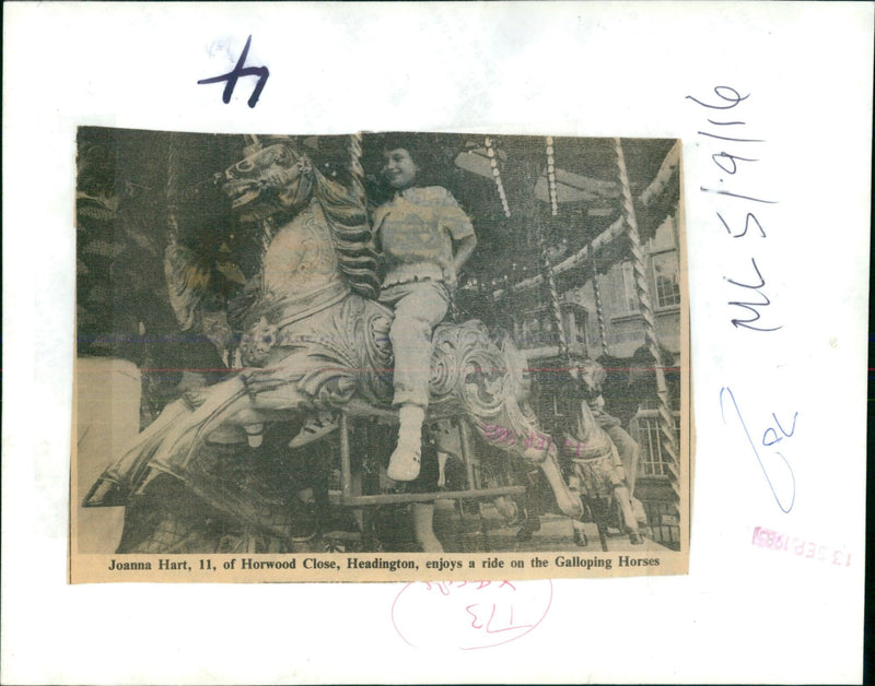 Joanna Hart enjoys a ride on the Galloping Horses. - Vintage Photograph