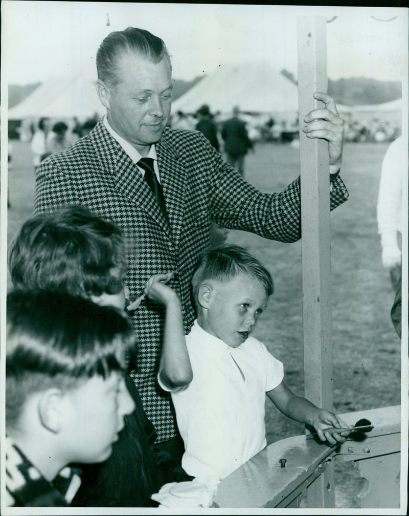 Father and son enjoying a game of darts - Vintage Photograph