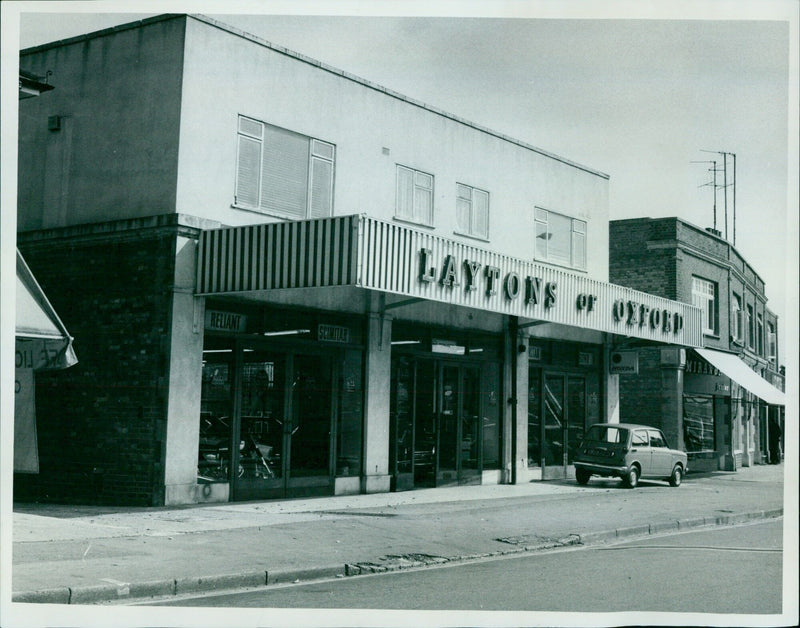 A vintage DeLorean Tic Reliant Scimitar vehicle is on display outside of Laytons of Offold. - Vintage Photograph