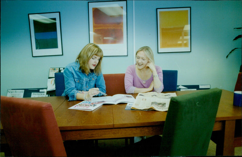 Managing Director Angie Moxon and Chairman Jy Le Fevre discuss a project at their Oxford offices. - Vintage Photograph