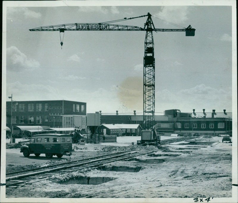 Construction is underway on a new 250,000 pound training centre in Oxford, England. - Vintage Photograph