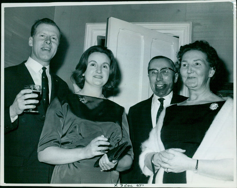 Members of the A. C. Nielsen Company staff and their guests celebrate 25 years in Britain and two in Oxford at a dinner and dance. - Vintage Photograph