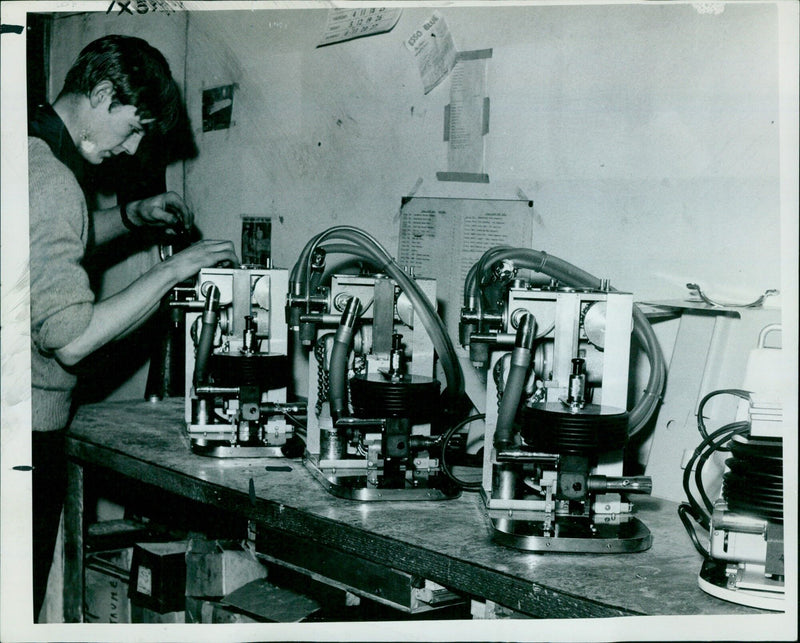 Mr. Tony Hewitt assembling a respirator at East & Co. - Vintage Photograph