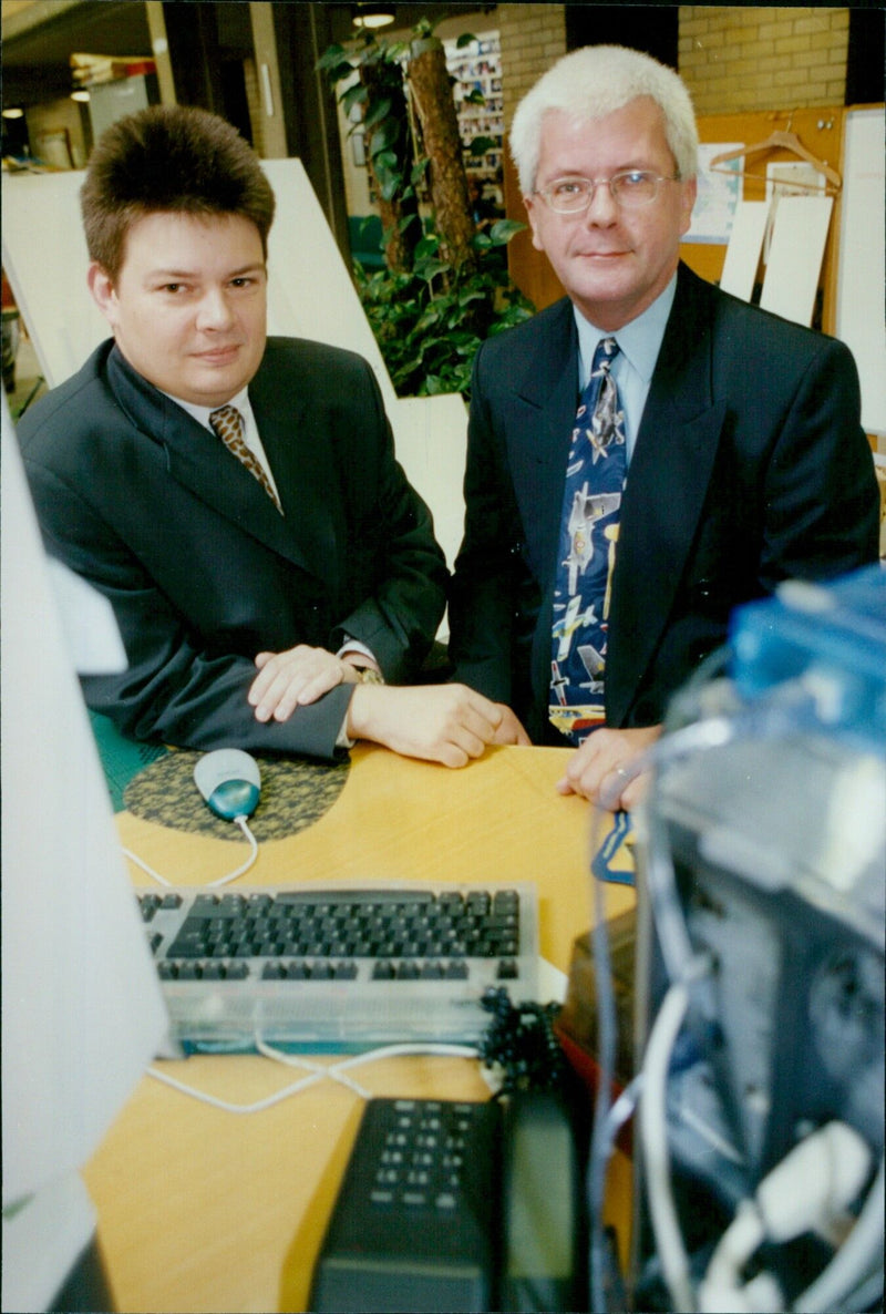 Martin Lee and Dave Johnson, founders of The Naming Company, pose for a photo. - Vintage Photograph