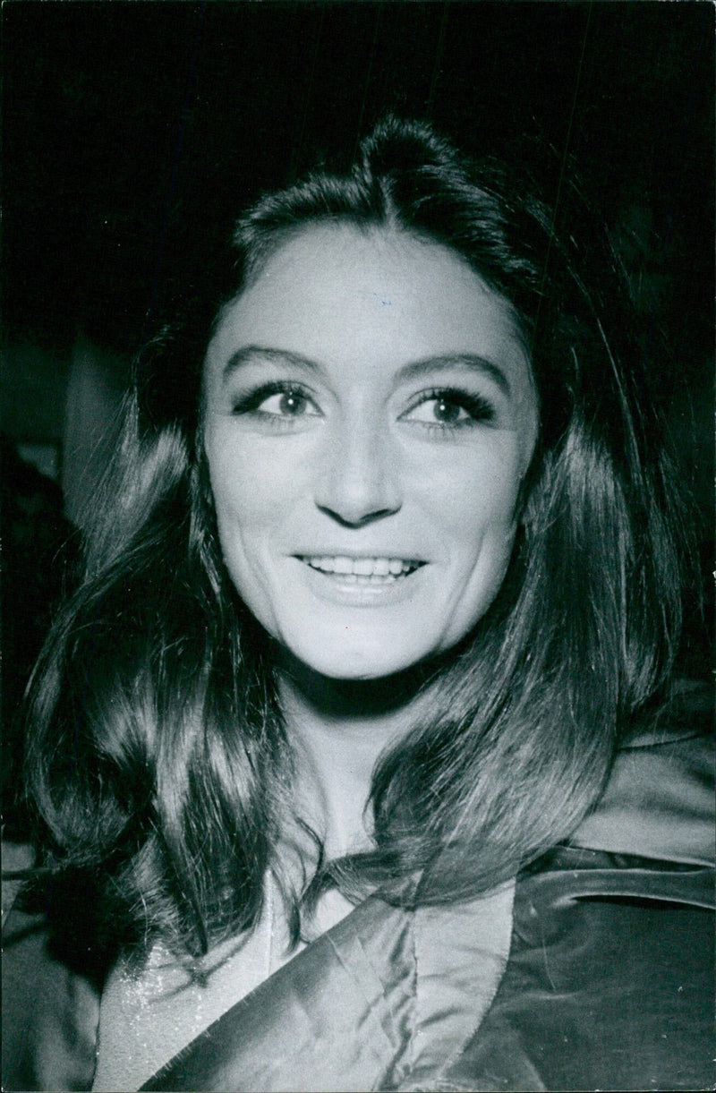 A photographer from Reporteurs Associés of Oxfordet takes a picture of Quouk Aimée in Paris, France. - Vintage Photograph