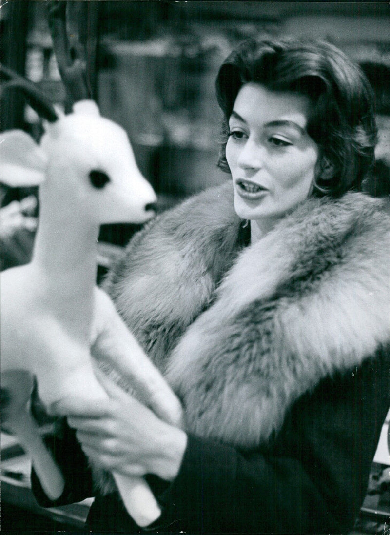 Actress Anouk Aimée smiles for the camera during a press event at TONAL Mais Reportage in France. - Vintage Photograph