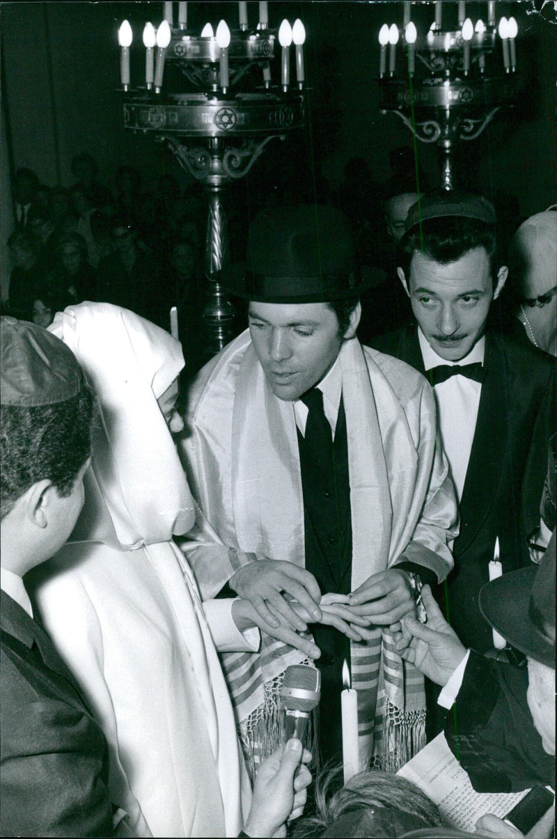 A group of people from different cultures are pictured together in Stockholm, Sweden, on April 25, 1000. They are engaged in conversation and appear to be discussing something of importance. - Vintage Photograph