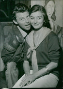 Anouk Aimee and Gerard Philippe attend the 1958 Cannes Film Festival, which was the first time the festival had been held since 1950. - Vintage Photograph