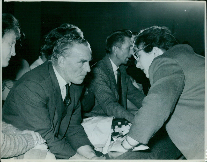 Mrs Olive Gibbs and Mr Ginger Bayliss discussing the Oxford flood vichms on July 21, 1967. - Vintage Photograph