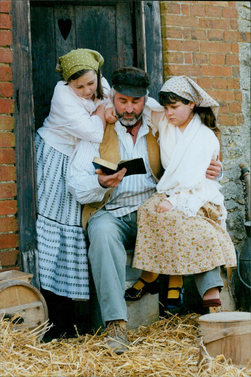 Eleanor Cartwright, Paddy Marshaece, Francesca Williams, and their youngest daughters pose for a family photo. - Vintage Photograph