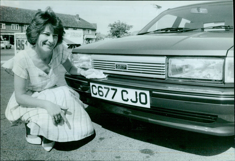 Jenny Roberts, an assistant at Kidlington, with a new C reg car. - Vintage Photograph