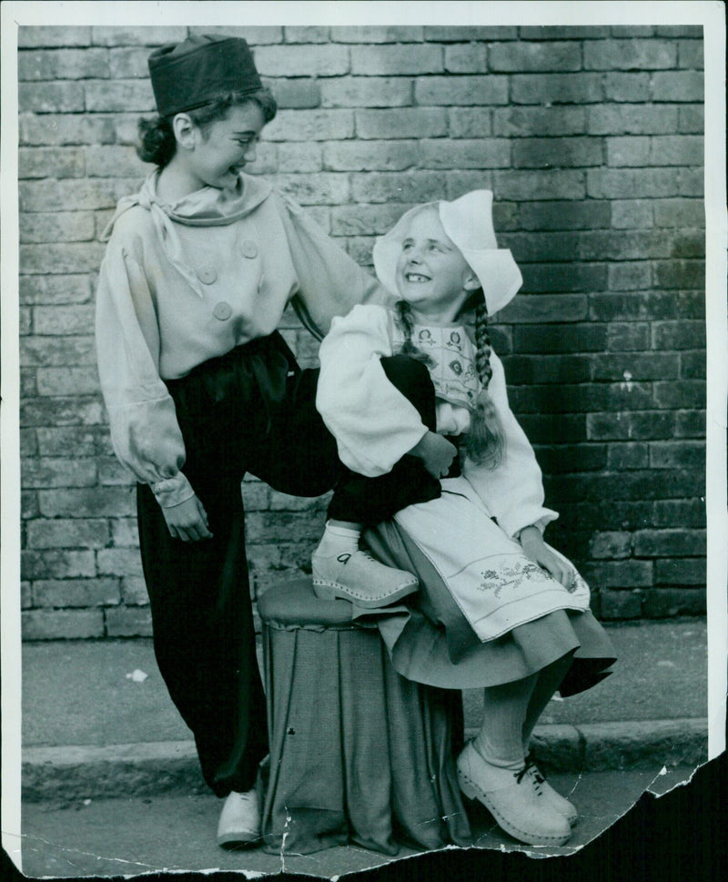 12-year-old Sandra Noon of Andover, a talented young character dancer, performs a Dutch boy and girl dance with 10-year-old Elisabeth Honeybell. - Vintage Photograph