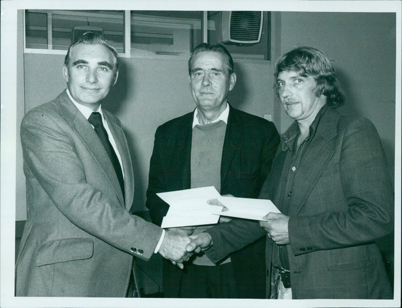 Cowley Body Plant Director, Mr. John Jackson, makes a presentation to two colleagues. - Vintage Photograph