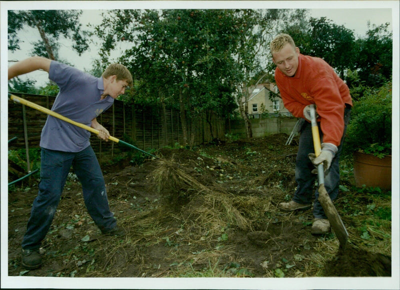 Matthew Steele and Keith Whitmore from Blooms of Blessingham work on a 5K garden makeover in Headington. - Vintage Photograph