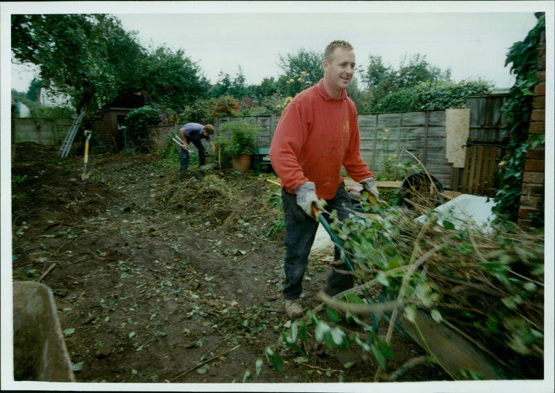 Matthew Steele and Keith Whitmore clear an area for the 5K Garden Makeover at Stapleton Road in Headington. - Vintage Photograph