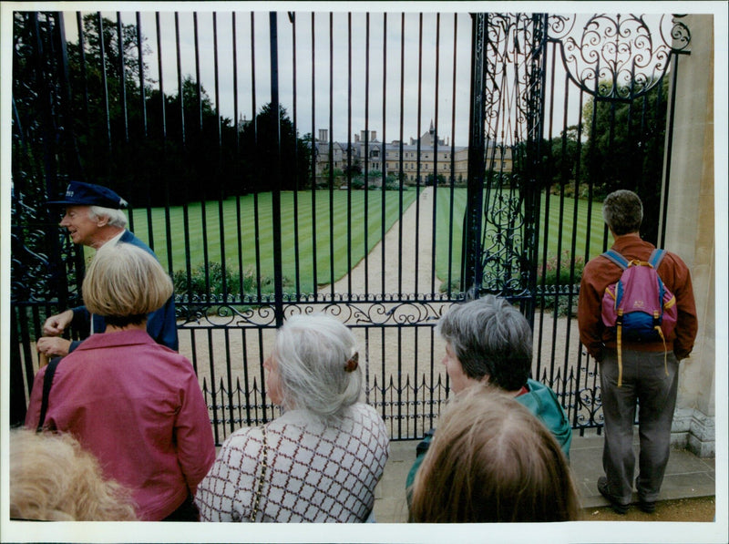 Tour guide Peter Berry leads a literary walking tour in Oxford, England. - Vintage Photograph