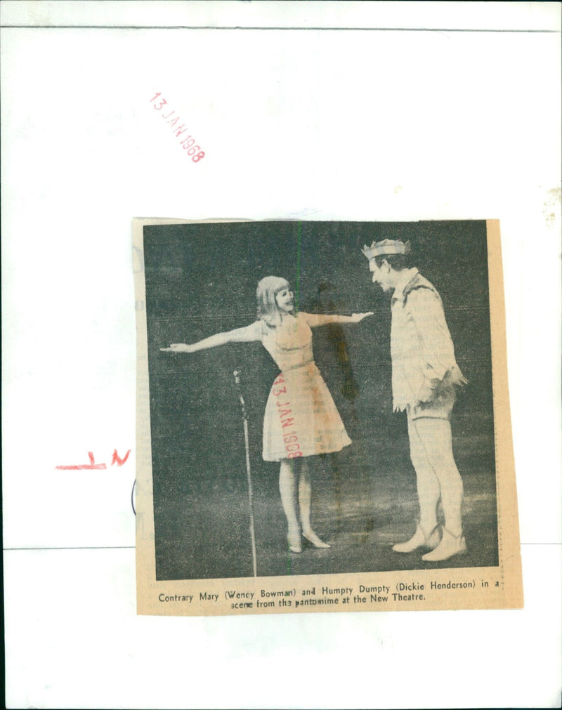 Actors Mary Bowman and Dickie Henderson perform in a scene from a pantomime at the New Theatre. - Vintage Photograph