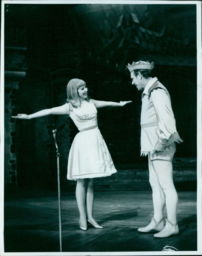 Actors Mary Bowman and Dickie Henderson perform in a scene from a pantomime at the New Theatre. - Vintage Photograph