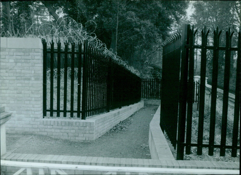 Pergamon Press in Oxford, England surrounded by a barbed wire fence. - Vintage Photograph