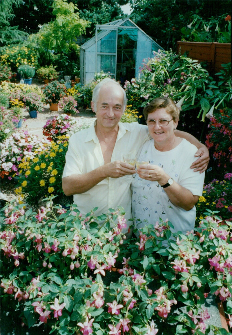 Michael and Jenny Edwards pose with their award-winning garden in Oxford. - Vintage Photograph