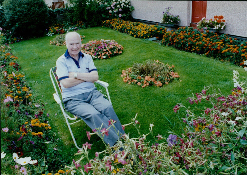 Community members come together to create floral displays in Oxford. - Vintage Photograph