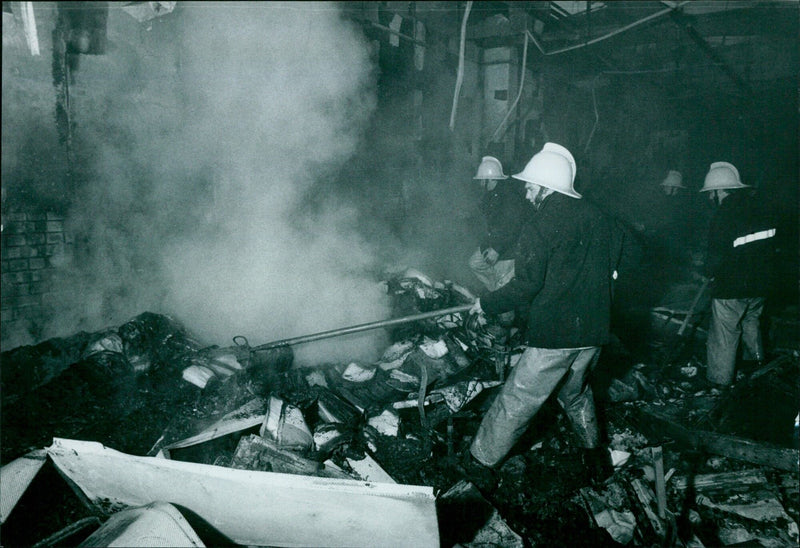 Firefighters battle a blaze at the Pergamon Press office building. - Vintage Photograph