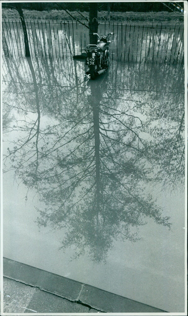 Flood water strands a motorcycle in Oxford. - Vintage Photograph