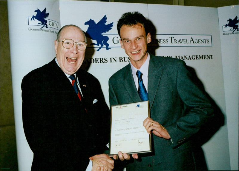 Members of the Guild of Business Travel Agents meet in London to discuss industry trends. - Vintage Photograph