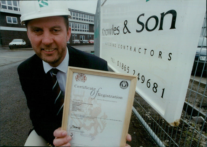 Tony Munsey holds the International Quality Award ISO 9001 won by Knowles and Son (Oxford) Limited. - Vintage Photograph